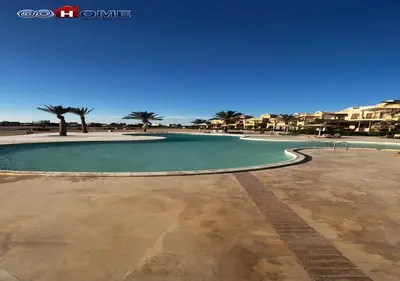 a large pool of water with palm trees and buildings at Apartment -Y97-0-8- 1 BR Sabina in Hurghada