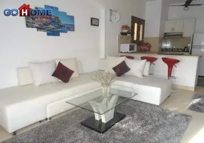 a living room with a white couch and a glass table at Apartment -Y97-0-8- 1 BR Sabina in Hurghada