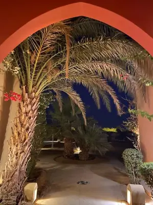 a room with a palm tree on the wall at Magical 2BR Ground/Free Pool & Lagoon Access @ElGouna in Hurghada