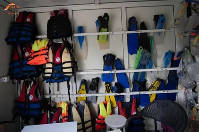 a bunch of umbrellas are hanging on a wall at Fox Resort El Gouna Stay in Hurghada