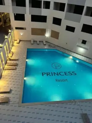 a swimming pool in the middle of a building at Hotel Room in Princess Resort With Beach Acces & Free Wi-fi I Near Air port in Hurghada