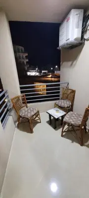 a balcony with two chairs and a table with a view at Hotel Room in Princess Resort With Beach Acces & Free Wi-fi I Near Air port in Hurghada