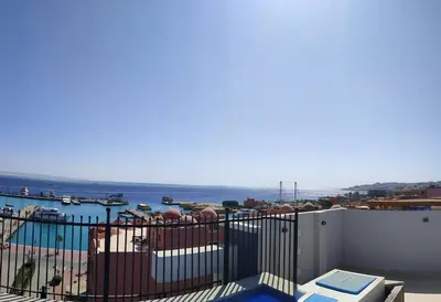 a view of the ocean from the balcony of a house at Condo with Breathtaking 's view with 2 bedrooms in Hurghada