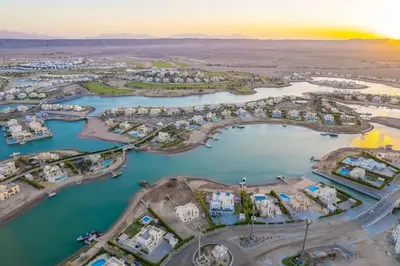 an aerial view of a harbor with a marina at Beach-Inspired 1BR in Mangroovy, El Gouna. Sea & Pool in Hurghada