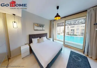 a bedroom with a bed and a large window at Stylish 1BR @ Mangroovy-M7-6B in Hurghada