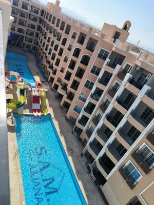 an aerial view of a large apartment complex with a swimming pool at Solo beach front studio or for couple in Hurghada