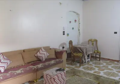 a living room with a couch and a table at Seashell in Quseir