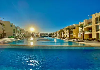 a large swimming pool in the middle of a building at Warm 1BR with @ Mangroovy, El-Gouna M1-7B in Hurghada
