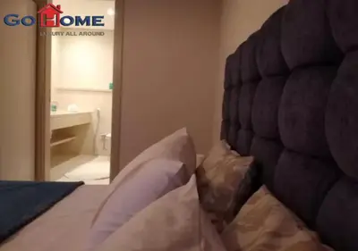a bedroom with a bed and a mirror and a bathroom at Warm 1BR with @ Mangroovy, El-Gouna M1-7B in Hurghada