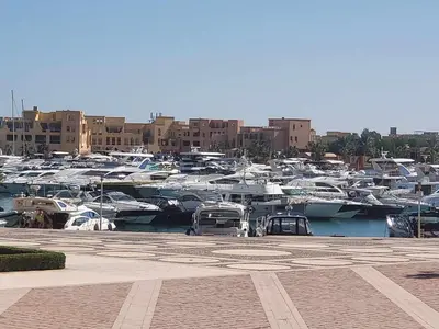 a bunch of boats parked in a marina with buildings at Elgouna - Directly To The Marina in Hurghada