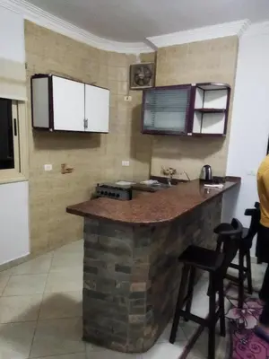 a kitchen with a brick counter and a sink at Hurghada city Apartment 4 in Hurghada