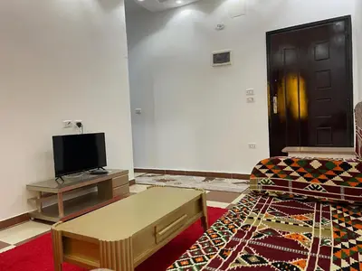 a living room with a couch and a coffee table at White Star House in Safaga