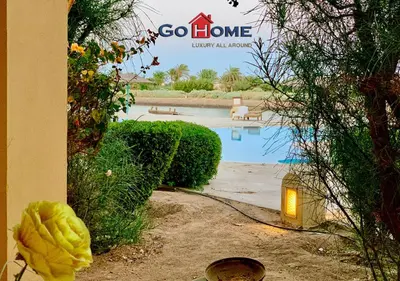 a sign that says go home next to a swimming pool at Friendly 1 Bed Room Y12 -0 West Golf at El-Gouna in Hurghada