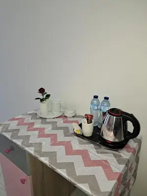 a table with a tea kettle and cups on it at Juliana beach resort in el ahead st in El Gouna
