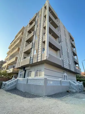 a large apartment building with balconies on the side at Divers Home Safaga in Safaga