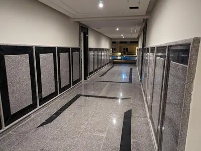 a hallway with a row of stalls in a building at Selena bay Resort with private beach - Voyage de rêve in Hurghada