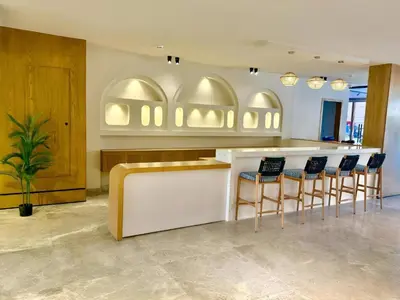a lobby with a bar with chairs around it at Selena bay Resort with private beach - Voyage de rêve in Hurghada