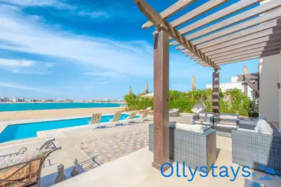 a villa with a swimming pool and a view at Ollystays Ancient Sands 4 BR Villa Heated Pool in Hurghada