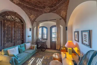 a living room with a couch and a table at Soulful 1BR in Italian Compound / Nubia, El Gouna in Hurghada