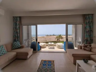 a living room with a view of the ocean at Relaxing open Seaview Apartment in Hurghada