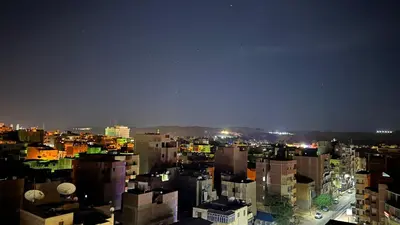 a view of a city at night with buildings at Unique studio in Aswan