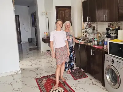 two women are standing in a kitchen at Esmerada in Aswan
