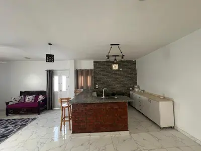 a kitchen with a sink and a brick wall at Muhammad Ali House in Luxor