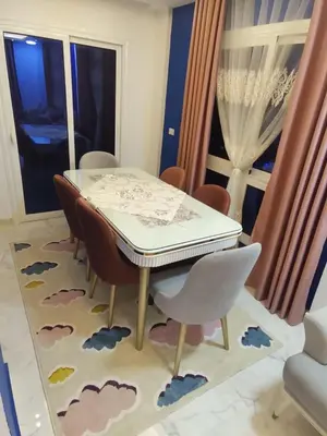 a dining room with a table and some chairs at Fanadir Bay Resort in Hurghada
