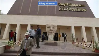 a group of people standing in front of a building at Abo Elwafa Hotel in Suwhaj