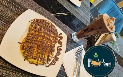a piece of cake on a plate on a table at جوليانا بيتش ريزورت in Hurghada