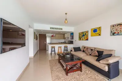 a living room with a couch and a table at El Gouna Luxury flat on the pool in El Gouna