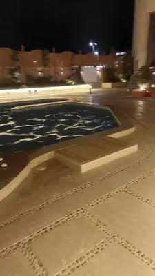 a sculpture on a street at night at La Quinta Resort Hurghada in Hurghada