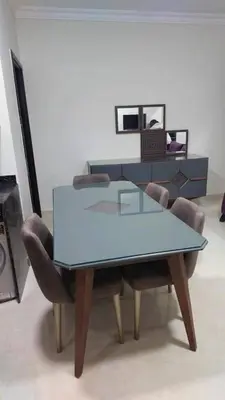 a glass table and chairs in a living room at La Quinta Resort Hurghada in Hurghada