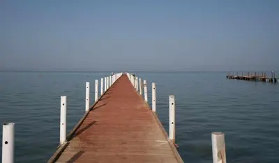 a wooden pier stretches out into the water at Fox Hotel El Ahyaa in Hurghada