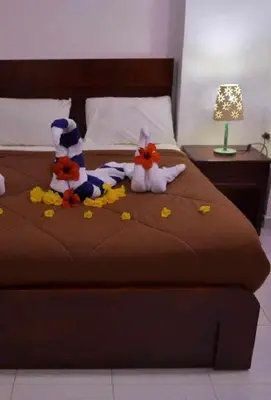two stuffed animals sitting on top of a bed at Fox Hotel El Ahyaa in Hurghada