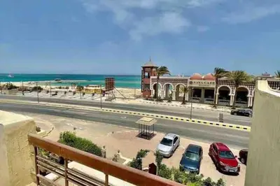 a view of a street with cars parked in a parking lot at Villa 2 apartment 4 village veiw infront of Palma de Meritee in Hurghada