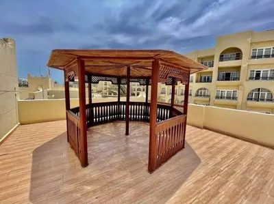 a gazebo on the roof of a building at Villa 2 apartment 4 village veiw infront of Palma de Meritee in Hurghada