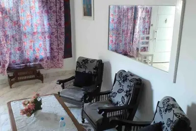 a living room with chairs and a table and a mirror at Villa 2 apartment 2 village veiw infront of Palma de Meritee in Hurghada