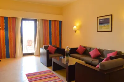 a living room with a couch and a table at Viva Blue Resort and Diving Sharm El Naga (Adults Only) in Hurghada