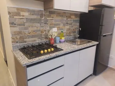 a kitchen counter with a stove and a sink at Makramia New Studio near to the beach in Hurghada