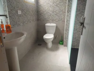 a bathroom with a toilet and a sink at Makramia New Studio near to the beach in Hurghada