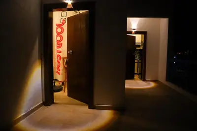 a doorway to a room with a sign on the wall at Hostgool Beach Chalets Mirage bay resort & aqua park in Hurghada