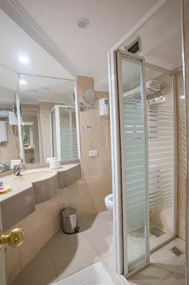 a bathroom with a shower and a sink and a toilet at 5 Days / 4 Nights Cruise Trip from Luxor to Aswan With all Visits Every Saturday, Monday and Thursday in Luxor