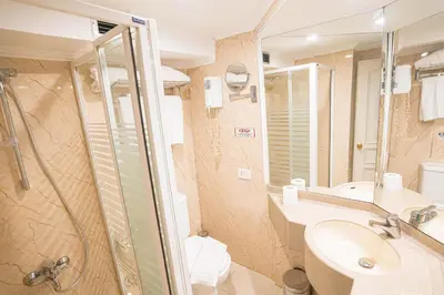 a bathroom with a shower and a sink and a toilet at 5 Days / 4 Nights Cruise Trip from Luxor to Aswan With all Visits Every Saturday, Monday and Thursday in Luxor
