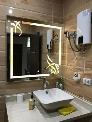 a bathroom with a sink and a mirror at Mirage Aqua Resort 2 Bedroom Apartment in Hurghada