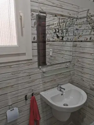 a bathroom with a sink and a mirror at Schöne Europäische 3 Zimmer Wohnung in Al Dahar in Hurghada