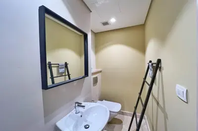 a bathroom with a sink and a mirror at Smooth & Snug 1 BDR Mangroovy Free Beach & Pool Access in Hurghada