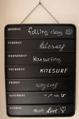 a black sign hanging on a wall with different words at Mangroovy - Spacious Boho 2 BR Pool view in Hurghada