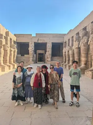 a group of people standing in front of a building at Karima House in Luxor