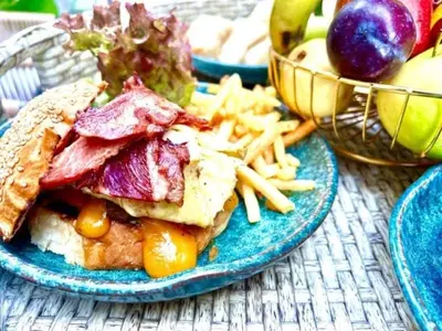 a plate of food with a sandwich and french fries at Imperial Resort Hurghada-The Hurghada Hideaway in Hurghada
